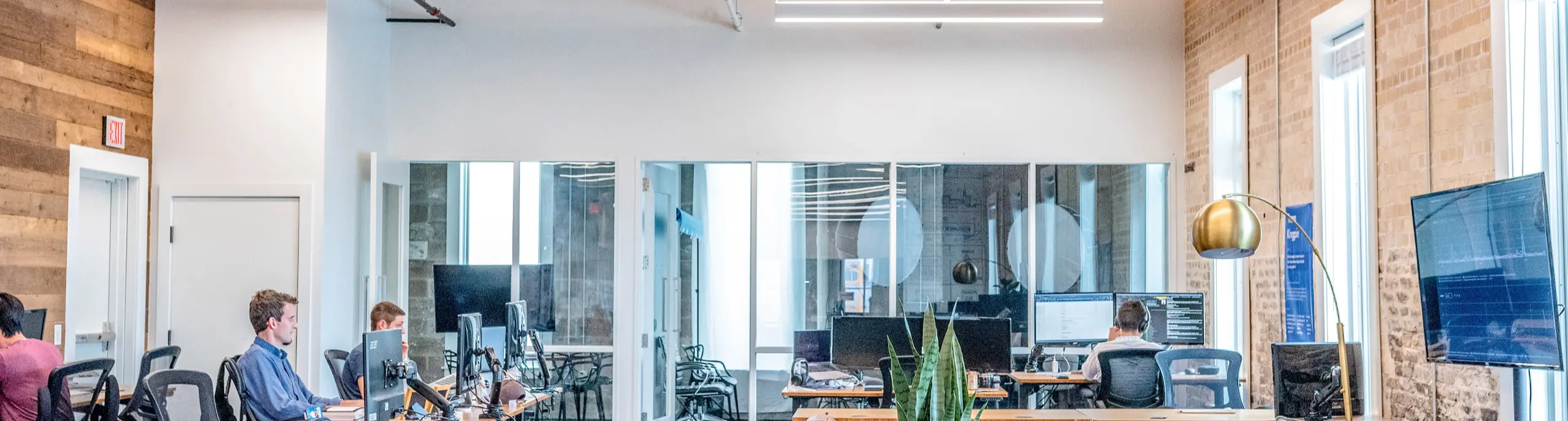 An open plan office with engineers working at their desks